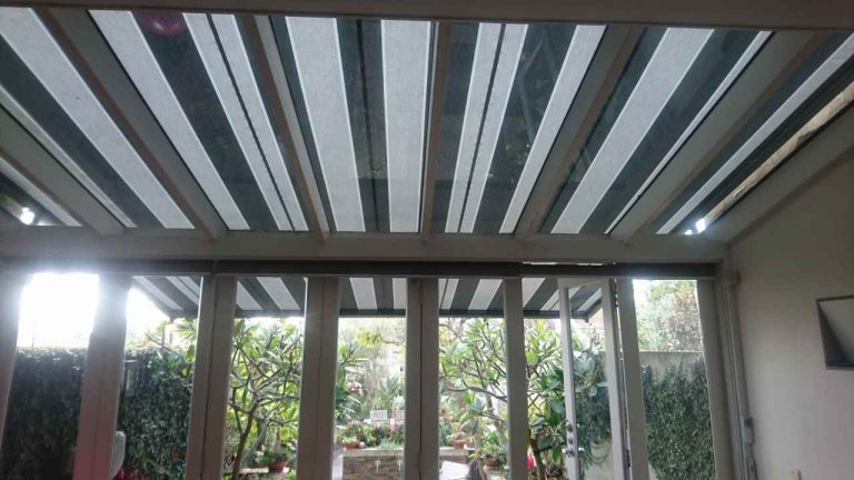 Inside look of awnings with a captivating view of plants outside